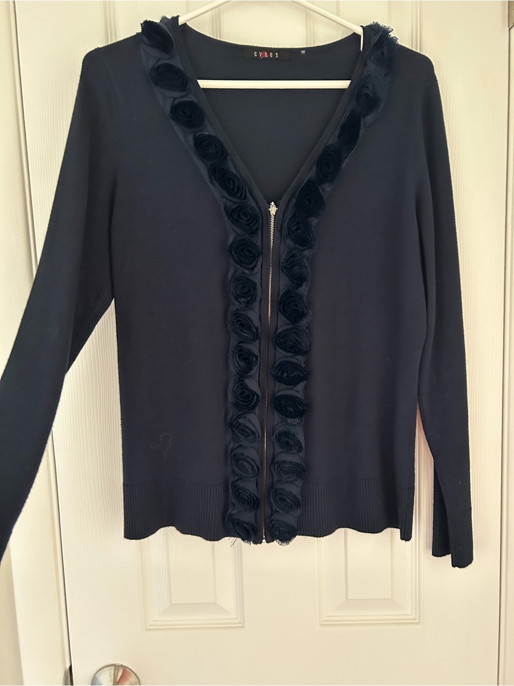 Cyrus Black Long-Sleeve Zip Front Sweater with Rosette Trim